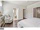 Bright bedroom with hardwood floors and ensuite bath at 5158 Noble Village Way # 35, Lilburn, GA 30047