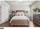 Bedroom with hardwood floors and cozy seating at 5158 Noble Village Way # 35, Lilburn, GA 30047