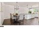Elegant dining room with hardwood floors and a beautiful chandelier at 5158 Noble Village Way # 35, Lilburn, GA 30047