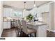 Modern kitchen with white cabinets and a breakfast bar at 5158 Noble Village Way # 35, Lilburn, GA 30047