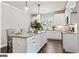 Modern kitchen with white cabinets and a large island at 5158 Noble Village Way # 35, Lilburn, GA 30047