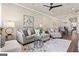 Open living room with hardwood floors and neutral color palette at 5158 Noble Village Way # 35, Lilburn, GA 30047