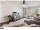 Living room with hardwood floors, comfortable seating and large windows at 5158 Noble Village Way # 35, Lilburn, GA 30047