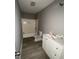 Clean bathroom, tub shower combo, vinyl flooring, vanity at 1438 Rome Nw Dr, Atlanta, GA 30314