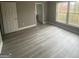 Spacious bedroom with gray walls, wood-look flooring, and large windows at 1438 Rome Nw Dr, Atlanta, GA 30314