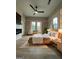 Main bedroom with hardwood floors, a ceiling fan and plenty of natural light at 1838 Moore Nw St, Atlanta, GA 30318