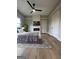 Main bedroom includes hardwood floors, fireplace, and ceiling fan at 1838 Moore Nw St, Atlanta, GA 30318