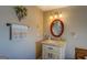 Charming bathroom with granite countertop, updated vanity, and decorative mirror at 885 Malcom Rd, Covington, GA 30014