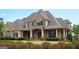 Two-story house with stone accents and a large front porch at 120 National Way, Carrollton, GA 30116