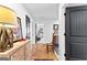 Upstairs hallway with hardwood floors and art at 112 Twelve Parks Trail, Sharpsburg, GA 30277