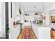 Bright kitchen featuring white cabinets, granite counters, and a center island at 112 Twelve Parks Trail, Sharpsburg, GA 30277