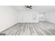 Spacious living room with gray vinyl plank flooring and ceiling fan at 3452 Arabian Farm Ln, Dacula, GA 30019