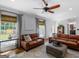 Sunlit living room with hardwood floors and two sofas at 2270 Emerald Drive, Jonesboro, GA 30236