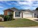 Brick and vinyl-sided house with a two-car garage and a well-maintained lawn at 208 Autumn Lake Way, Mcdonough, GA 30253