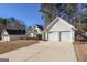 House exterior showcasing a two-car garage and driveway at 302 Preston Chase Dr, Peachtree City, GA 30269