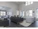 Comfortable clubhouse living area with gray sofas and a large window at 940 Hesston Dr, Locust Grove, GA 30248