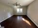 Bedroom with dark hardwood floors and ceiling fan at 361 Almon Rd, Covington, GA 30014