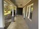 Front porch with gray painted walls and white trim, light blue door visible at 361 Almon Rd, Covington, GA 30014
