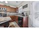 Kitchen with dark wood cabinets, tile backsplash, and island at 11075 Shadow Ct, Hampton, GA 30228