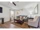 Living room with hardwood floors, neutral color scheme, and cozy seating at 11075 Shadow Ct, Hampton, GA 30228