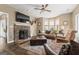 Spacious living room features a stone fireplace, hardwood floors, and ample natural light at 800 Clover Dr, Social Circle, GA 30025