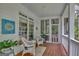 Screened porch with wicker chairs and a peaceful setting at 100 Dresden Pl, Fayetteville, GA 30215