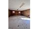 Unfinished basement with wood walls and carpeted floor at 779 Dial Mill Rd, Oxford, GA 30054