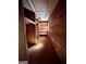 Unfinished basement area with wood walls and shelving at 779 Dial Mill Rd, Oxford, GA 30054