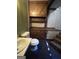 Small bathroom with toilet and sink; access to stairs at 779 Dial Mill Rd, Oxford, GA 30054