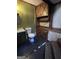 Rustic bathroom with wooden cabinets and tiled floor at 779 Dial Mill Rd, Oxford, GA 30054