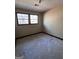 Simple bedroom with two windows and carpeted floor at 779 Dial Mill Rd, Oxford, GA 30054