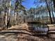 Private driveway beside a pond in wooded setting at 779 Dial Mill Rd, Oxford, GA 30054