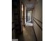 Long hallway with doors to other rooms and built-in shelving at 779 Dial Mill Rd, Oxford, GA 30054