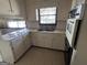 Dated kitchen with built-in appliances and ample cabinets at 779 Dial Mill Rd, Oxford, GA 30054