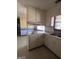 Bright kitchen featuring ample cabinetry and a window overlooking the backyard at 779 Dial Mill Rd, Oxford, GA 30054