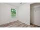 Bright bedroom featuring modern laminate flooring and ample natural light at 344 Rocky Creek Rd, Hampton, GA 30228