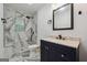 This bathroom features marble tile flooring and a walk-in shower with a black rainfall shower head at 344 Rocky Creek Rd, Hampton, GA 30228