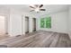 A spacious bedroom is brightened by natural light and includes a ceiling fan and a double closet at 344 Rocky Creek Rd, Hampton, GA 30228