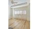 Bright bedroom with hardwood floors and plantation shutters at 100 Kindlehurst Dr, Tyrone, GA 30290