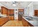 Eat-in kitchen with stainless steel appliances and wood cabinets at 460 Dixie Rd, Covington, GA 30014
