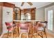 Custom wet bar with leather barstools and wine storage at 460 Dixie Rd, Covington, GA 30014