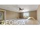 Spacious bedroom with hardwood floors and a view at 460 Dixie Rd, Covington, GA 30014
