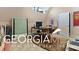 Home office with a desk and ample workspace at 460 Dixie Rd, Covington, GA 30014