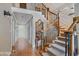 Elegant staircase with wrought iron railings and hardwood flooring at 460 Dixie Rd, Covington, GA 30014
