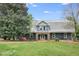 Luxury barn-style home with stone accents and manicured landscaping at 460 Dixie Rd, Covington, GA 30014