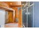 Small tack room with wooden walls and built-in shelving at 460 Dixie Rd, Covington, GA 30014