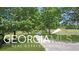 Long tree-lined driveway leading to a luxurious estate at 460 Dixie Rd, Covington, GA 30014