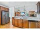 Open kitchen with island, granite counters and stainless steel appliances at 460 Dixie Rd, Covington, GA 30014