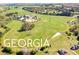 Aerial view of the property, showcasing the horse racing track at 460 Dixie Rd, Covington, GA 30014