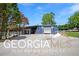 Blue metal outbuilding with large garage door at 460 Dixie Rd, Covington, GA 30014